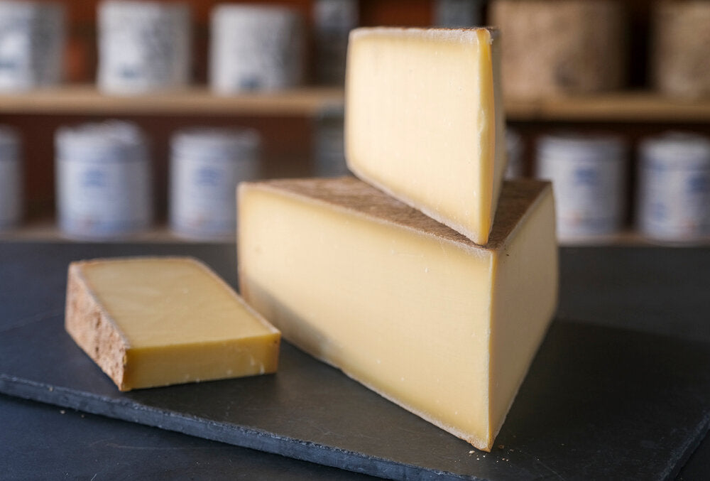 Display of Gruyere Suisse AOP, an unpasteurised hard alpine cheese from Switzerland made with cow's milk.