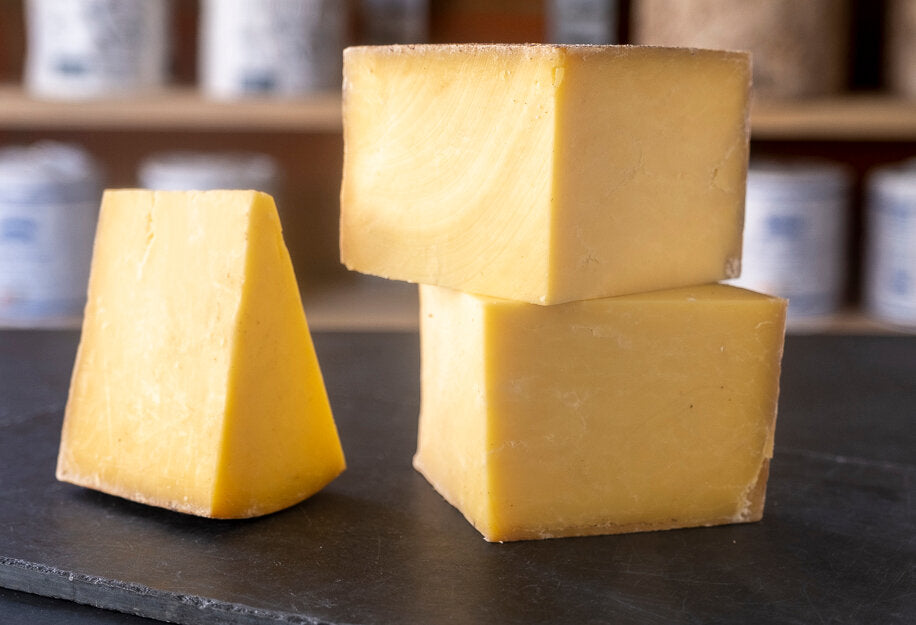 Display of Hafod Cheddar, an unpasteurised hard cheese from Wales, made with cow&#39;s milk