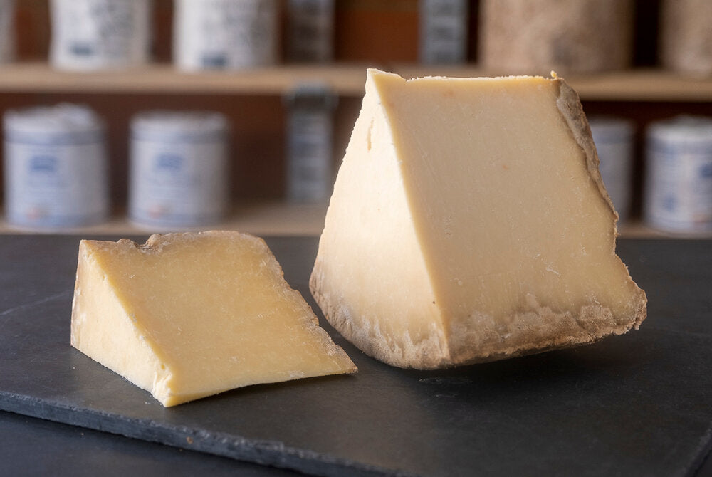 Display of Cantal au lait de Salers, an unpasteurised hard cheese from the Auvergne, made with cow&#39;s milk. 